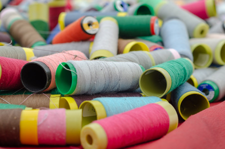 Multicolor sewing threads are for sale at the bazaar. It is messy and mixed.の写真素材