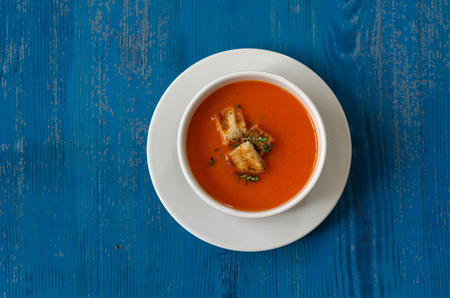 Bowl of tomato soup with croutons and fresh thymeの写真素材