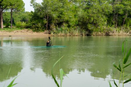 Antalya,TURKEY- April 25, 2019:  The young woman is  canoeing on the Besgoz River.のeditorial素材
