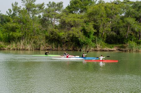 Antalya,TURKEY- April 25, 2019: Kayaks. The five boys are  canoeing on the Besgoz River.