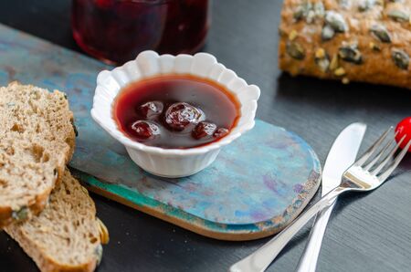 Delicious Sour Berry Jam in bowl  on the wooden table.の写真素材