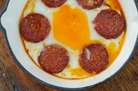 Turkish breakfast with fried egg,  sucuk on wooden table, top view.の写真素材