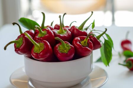 Red hot pepper on white bowl,close up,