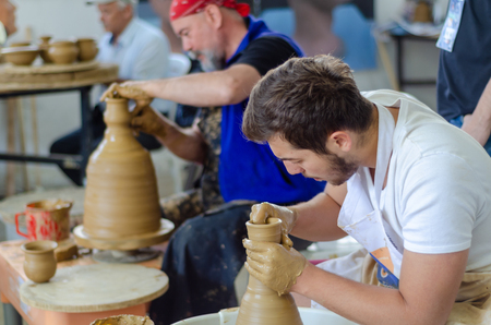 Eskisehir,TURKEY-September 08,2019: 13th.Eskisehir International Terra Cotta Symposium.The artists  show how to make bowl on potters wheelのeditorial素材