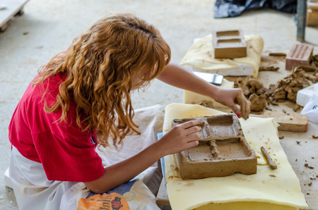 Eskisehir,TURKEY-September 10,2019: 13th.Eskisehir International Terra Cotta Symposium.The artist is shaping his work.のeditorial素材