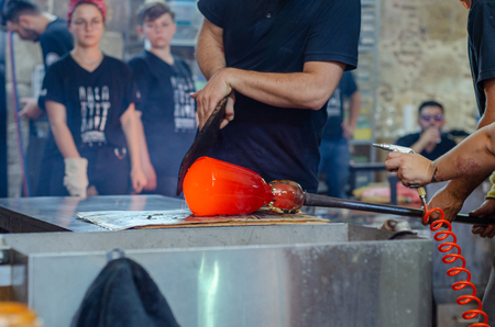 Eskisehir,TURKEY-September 28,2019: OdunpazarÄ± 7th international glass festival.Artist is shaping  his object.のeditorial素材