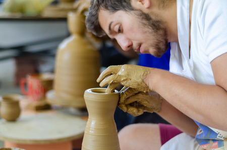Eskisehir,TURKEY-September 08,2019: 13th.Eskisehir International Terra Cotta Symposium.The artists  show how to make bowl on potters wheelのeditorial素材
