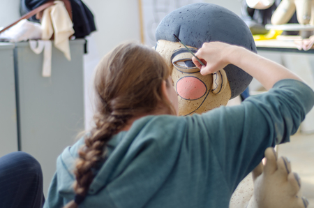 Eskisehir,TURKEY-September 10,2019: 13th.Eskisehir International Terra Cotta Symposium.The artist is painting his work.のeditorial素材