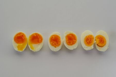 Boiled eggs are on the white background.の写真素材