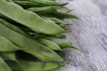 Group of green beans on white tableの写真素材