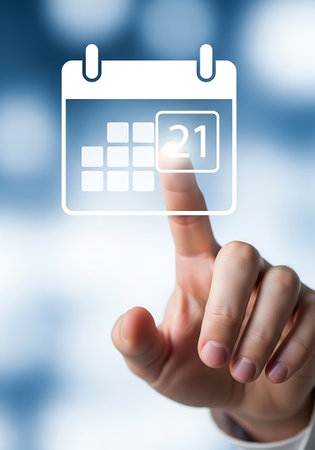 A hand touches a white calendar icon displaying the number 21. The background is a blue gradient.の素材