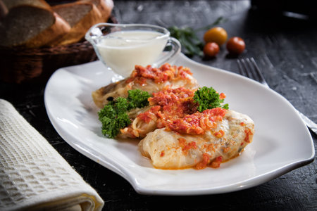 Cabbage rolls, cabbage stuffed with minced meat with garlic sauce.の写真素材