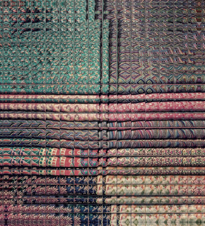 Closeup of a colorful patchwork pattern, textured background.