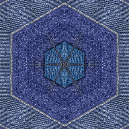 Blue jeans texture with a kaleidoscope pattern in the center.