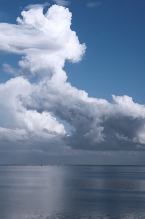 A big white cloud over the ocean