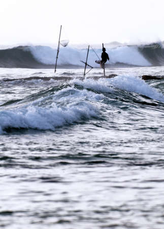 Silhouette of a fisherman from south of Sri Lankaの写真素材