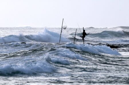 Silhouette of a fisherman from south of Sri Lankaの写真素材