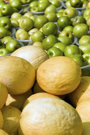Green apple and melon fruit on the marketの写真素材