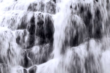 The water flowing over rocks, waterfall, Closeupの写真素材