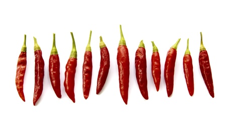 Red chilli peppers folded side by side in a row