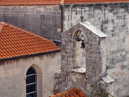 A belfry with one bell at the old cityの写真素材