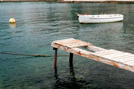 A picture of an old white boat の写真素材