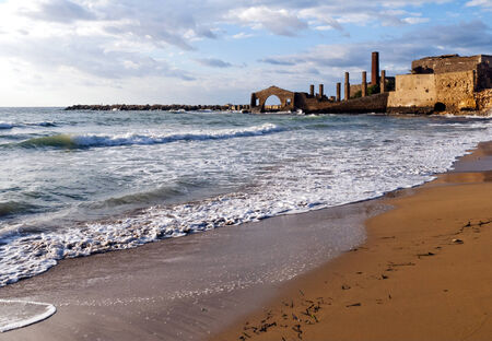 The landscape with the sea and factory ruins (Tonnara di Avola), Avola, Sicily (Italy)の写真素材