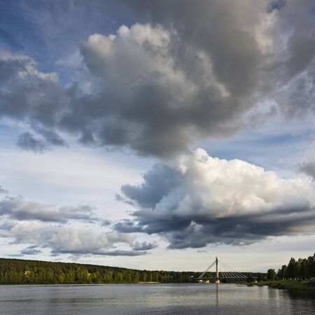 The landscape with the cloudy sky and a river. Finlandの写真素材