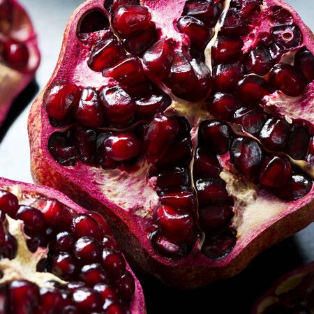 Detail of an open pomegranate on a gray backgroundの写真素材