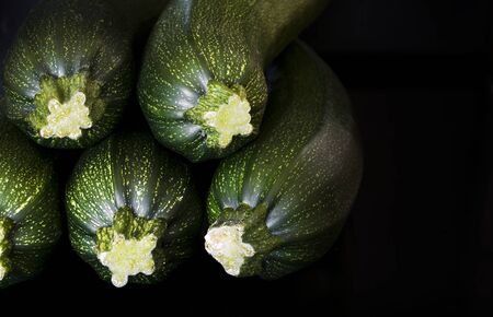 A closeup of a group of green zucchini (zucchetti, courgettes).の写真素材