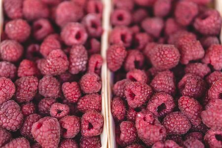 Raspberries on a farm market in the city. Selective focus.