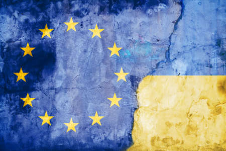 The concept of Ukraines accession to the European Union. Background with an old shabby wall on which...