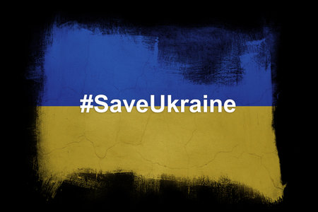 Save Ukraine, the concept of supporting Ukraine. The hashtag on the background of the flag of Ukraine.の写真素材