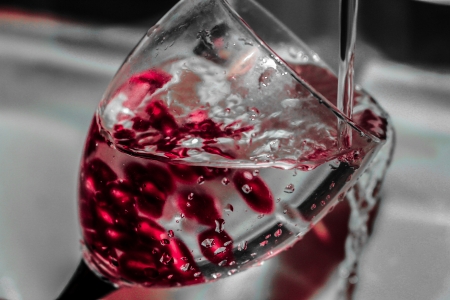 Glass with water and particlesの写真素材