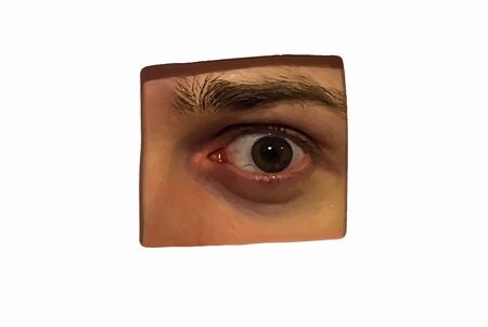 Human eye, seen through a hole in the wall isolated