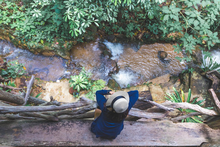 A girl lonely on river sideの写真素材