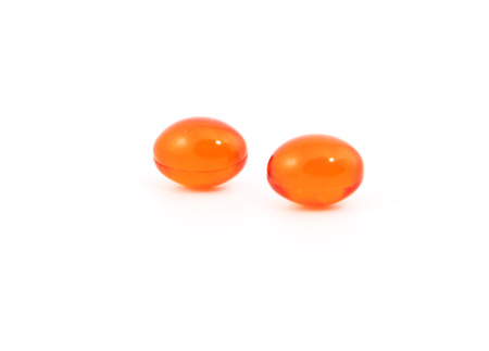 red pills on white backgroundの写真素材