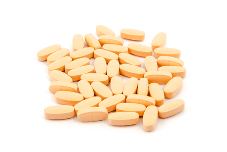 vitamin pills on a white backgroundの写真素材