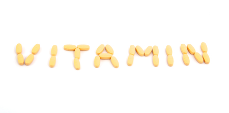 vitamin pills on a white backgroundの写真素材
