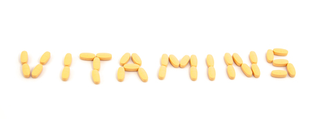 vitamin pills on a white backgroundの写真素材
