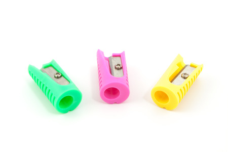 three colored pencil sharpeners, yello, pink, greenの写真素材