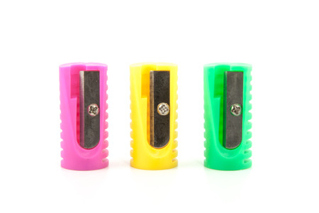 three colored pencil sharpeners, yello, pink, greenの写真素材