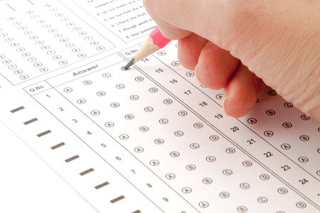 Answer the test with a pink pencilの写真素材