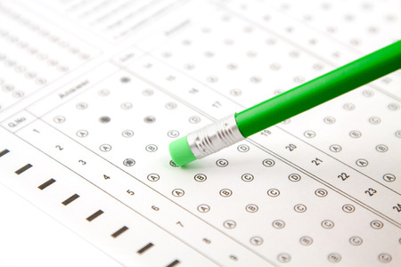 green pencil and answers to the testの写真素材