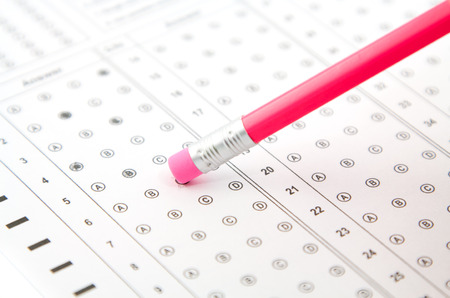 pink eraser on a pencil, and the answers to the testの写真素材