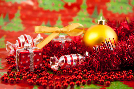 Red Christmas toys on a red backgroundの写真素材
