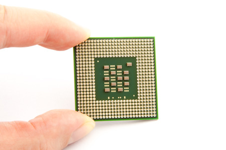 Computer Processor with hand on the white backgroundの写真素材