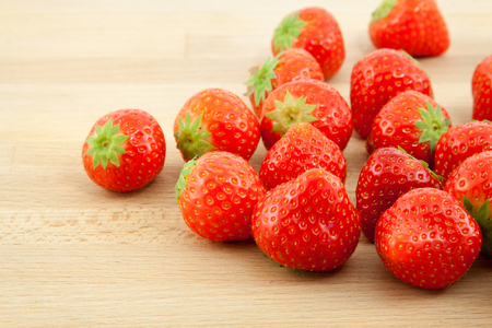 Red strawberries on the wood backgroundの写真素材