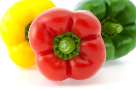 Yellow, red and green paprika on the white backgroundの写真素材