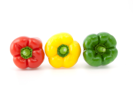 Yellow, red and green paprika on the white backgroundの写真素材